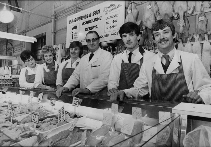 Butchers at counter in Derby Market Hall poultry market