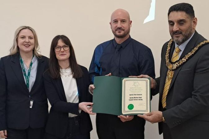 (L-R) Sam Dennis, the Council's Strategic Director of Place, Market Hall manager Hana York and operations manager Phil Carson accept the award from the Mayor of Derby