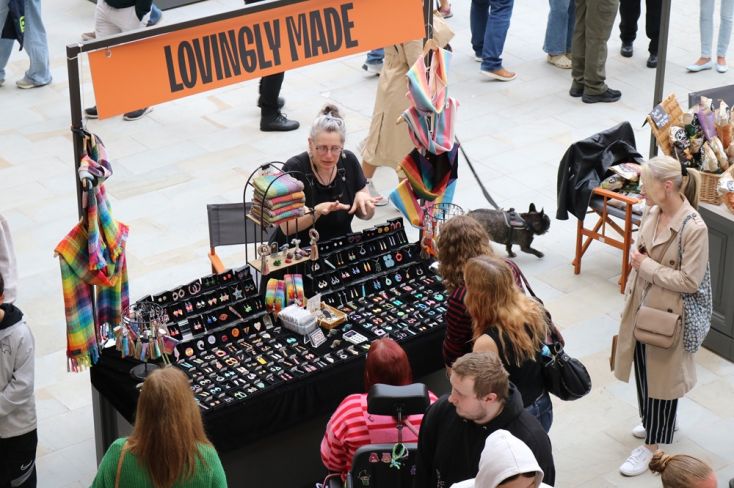 Pop up trader speaking to customers about products