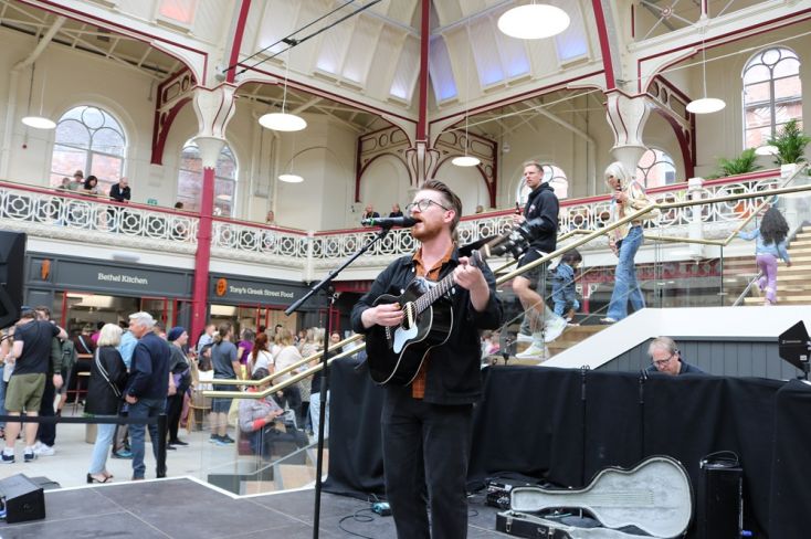 Carl North on stage at Derby Market Hall